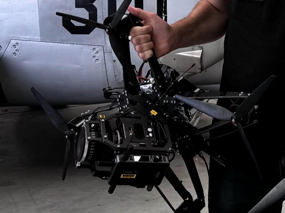 Custom heavy-lift camera platform with a cinema camera in an aircraft hangar