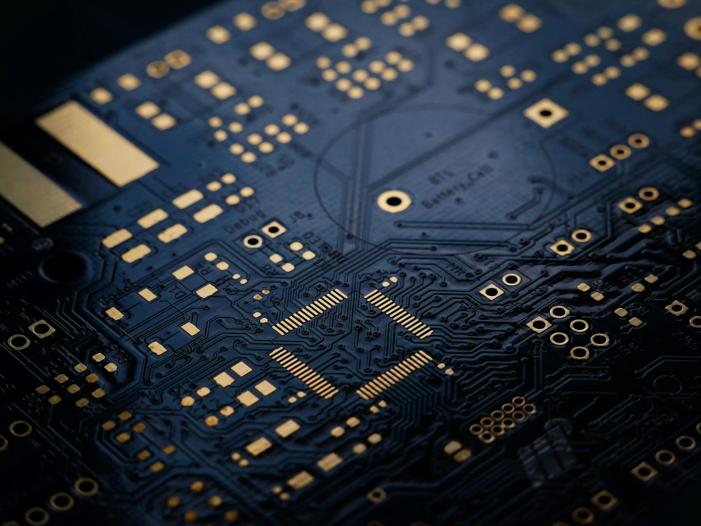 Macro of a custom printed circuit board with gold pads